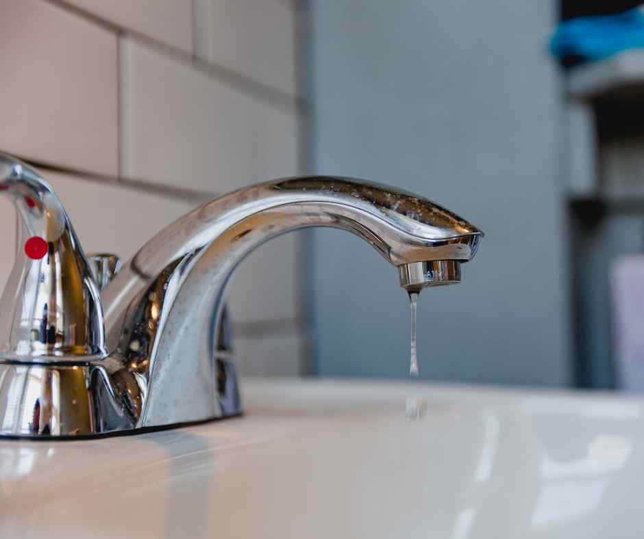 A dripping faucet in a bathroom