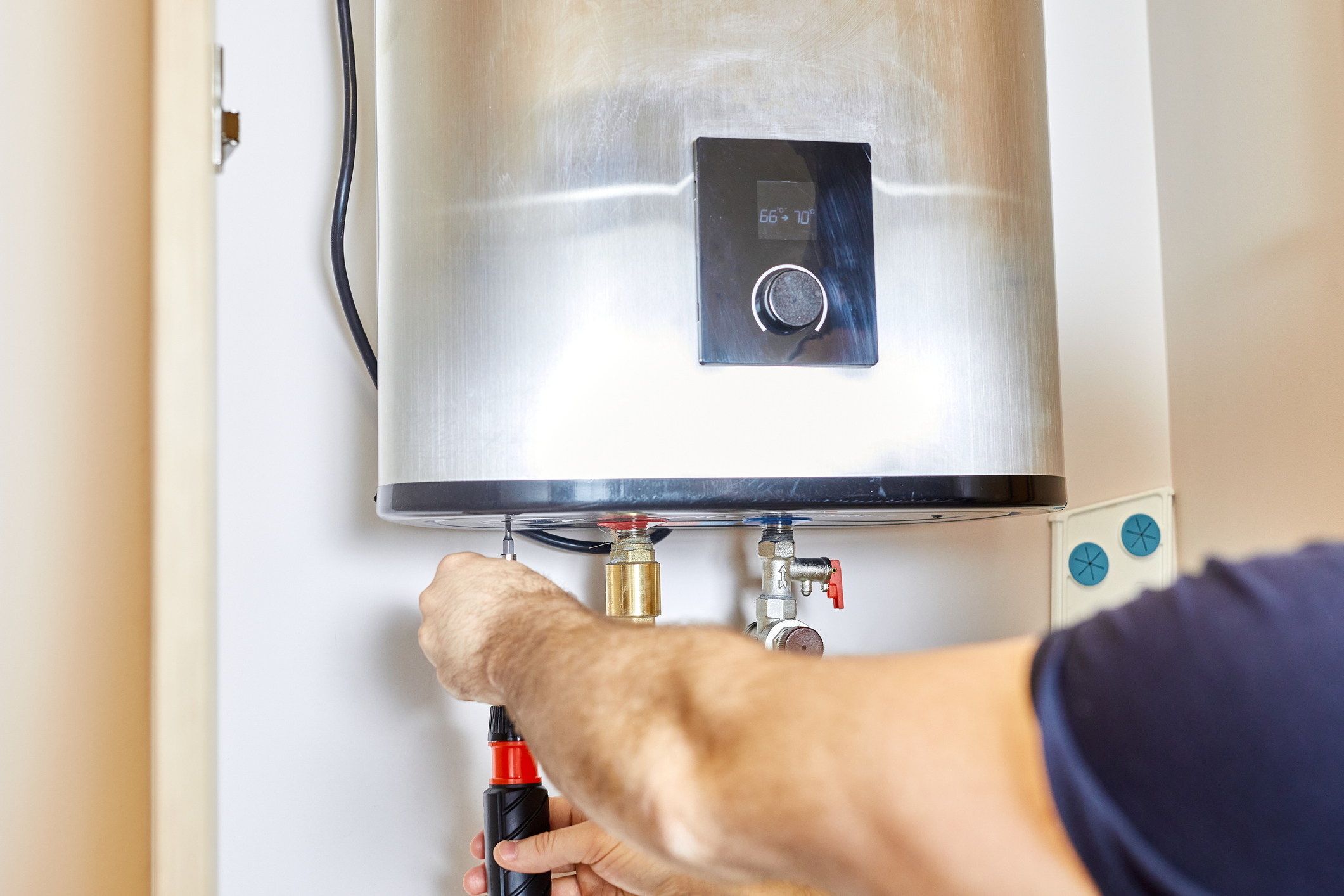 Technician Installing Water Heater